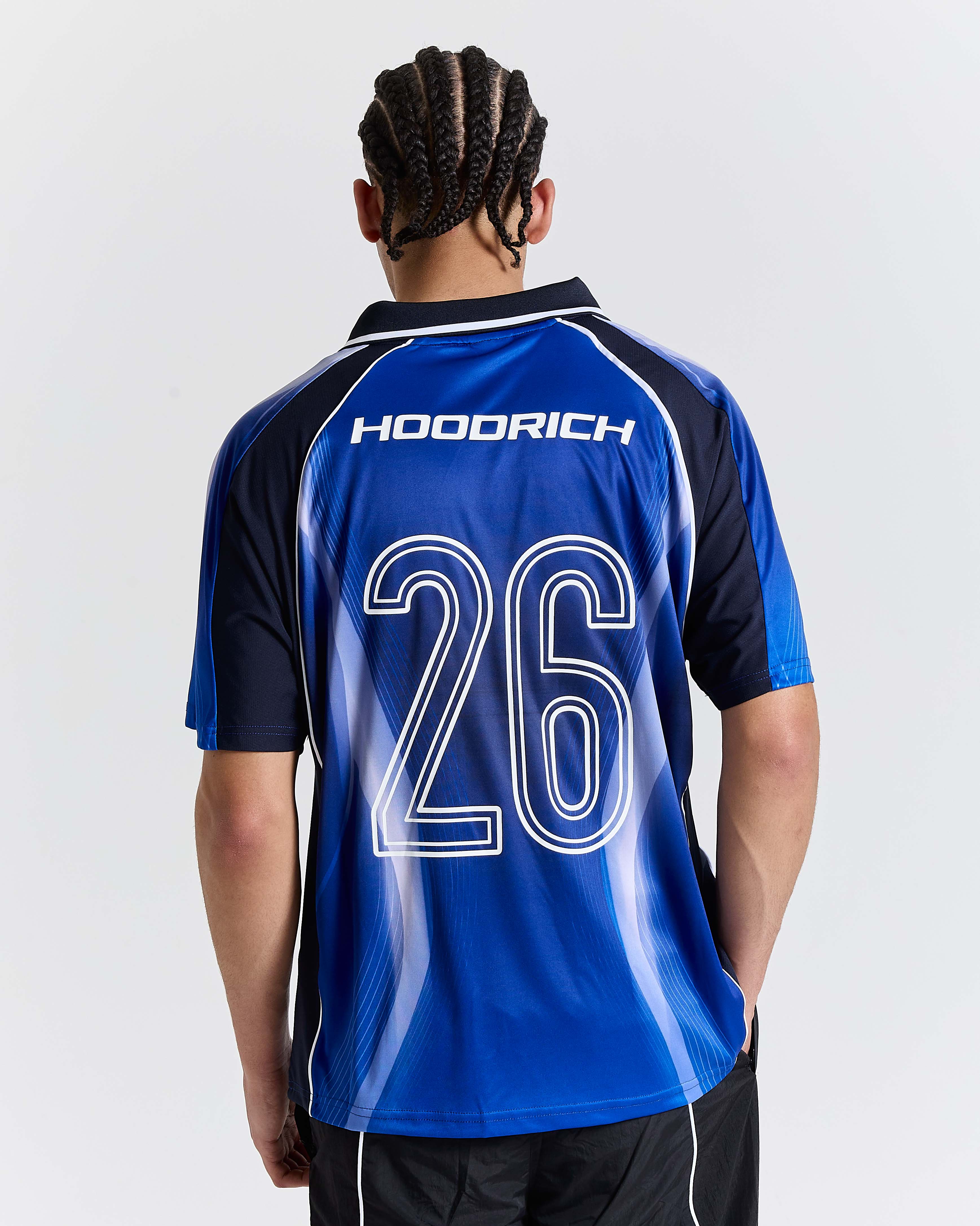 Person wearing a blue sports jersey with 'Hoodrich' branding and number 26 on a white background