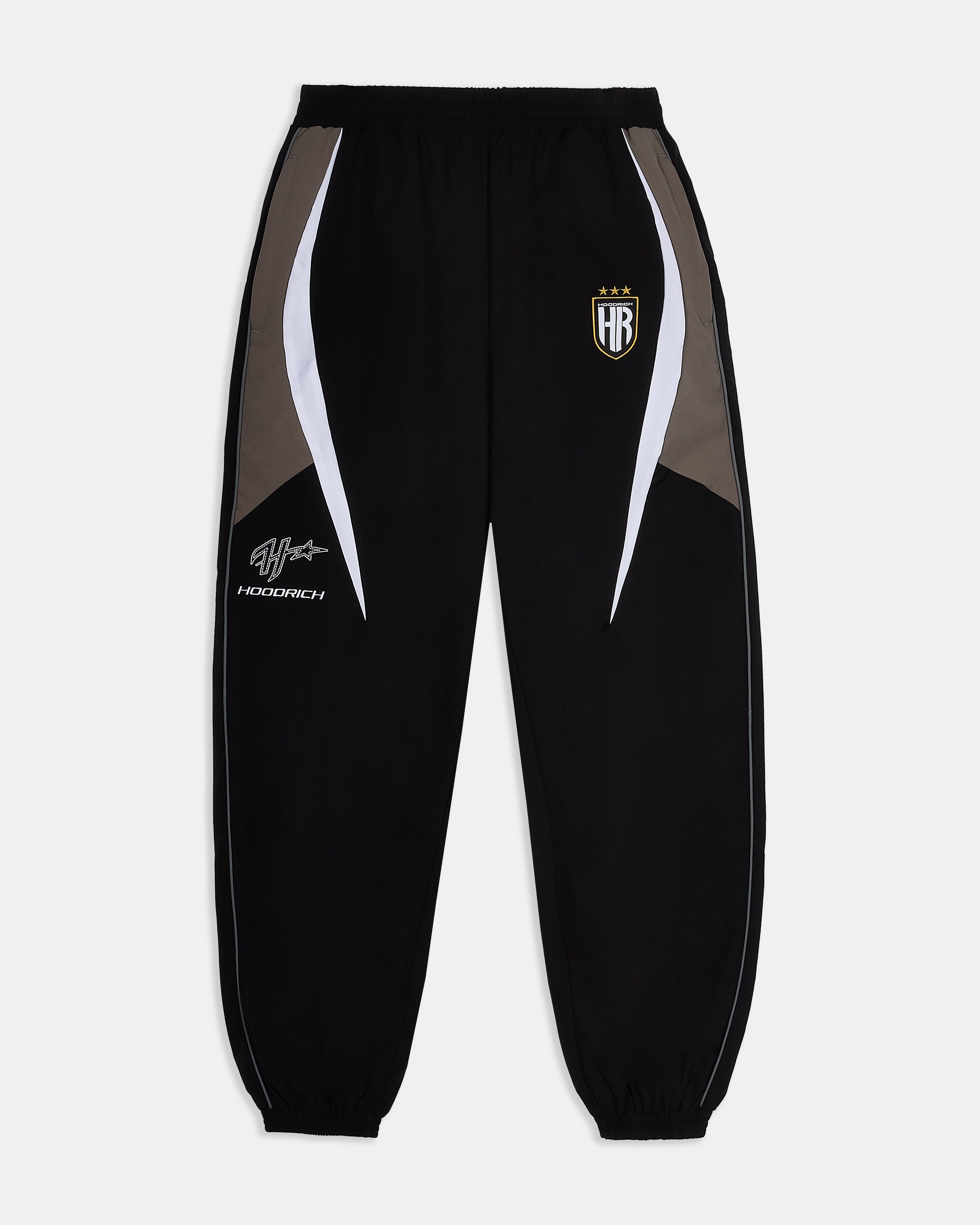 Black tracksuit pants with white and gray accents on a light gray background