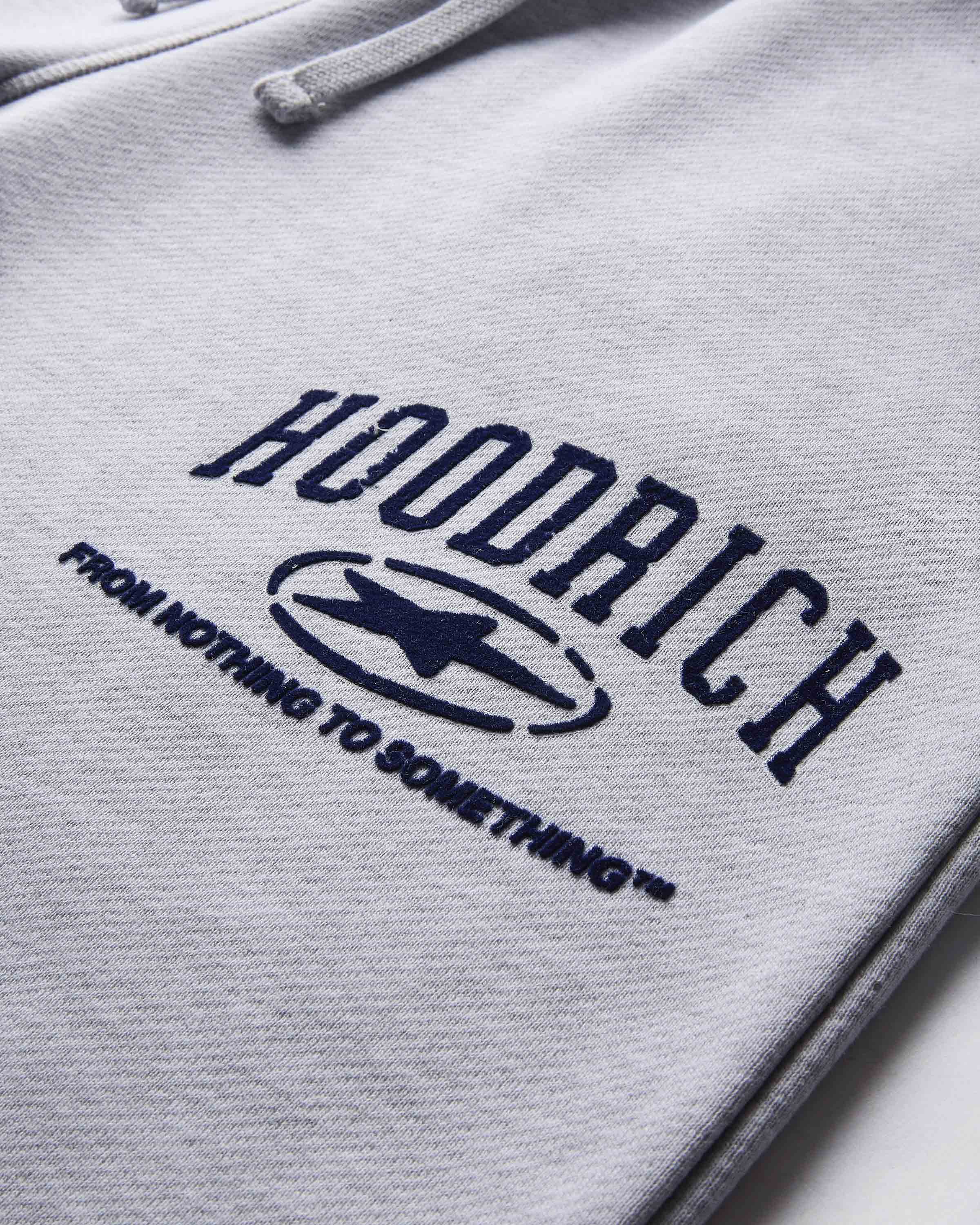 Gray hoodie with 'Hoodrich' logo and text on a light gray background