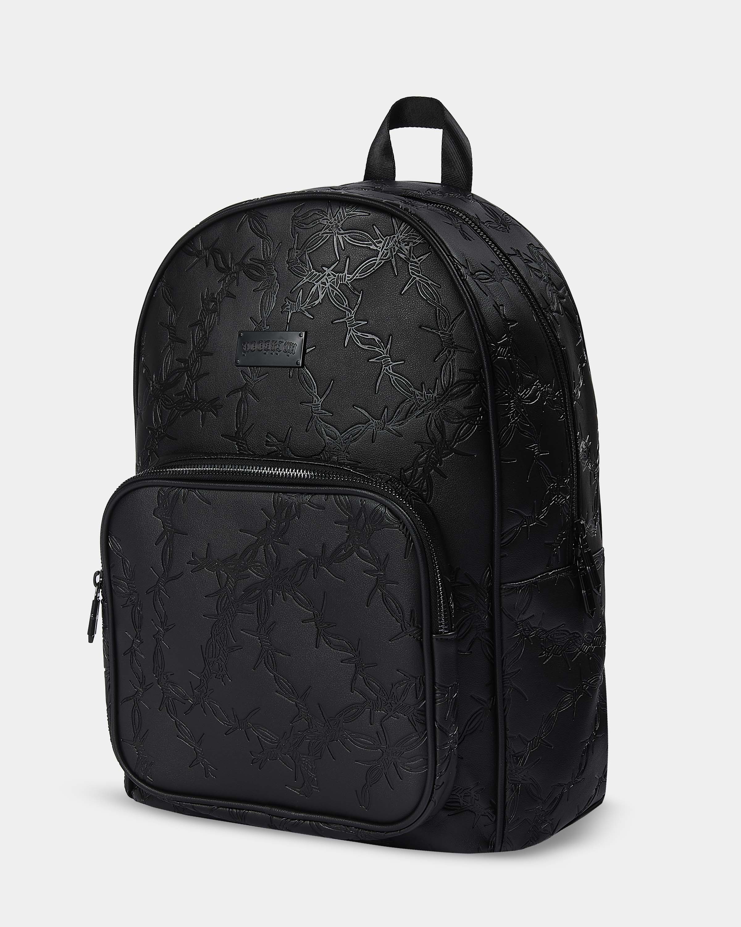 Black floral-patterned backpack on a light gray background