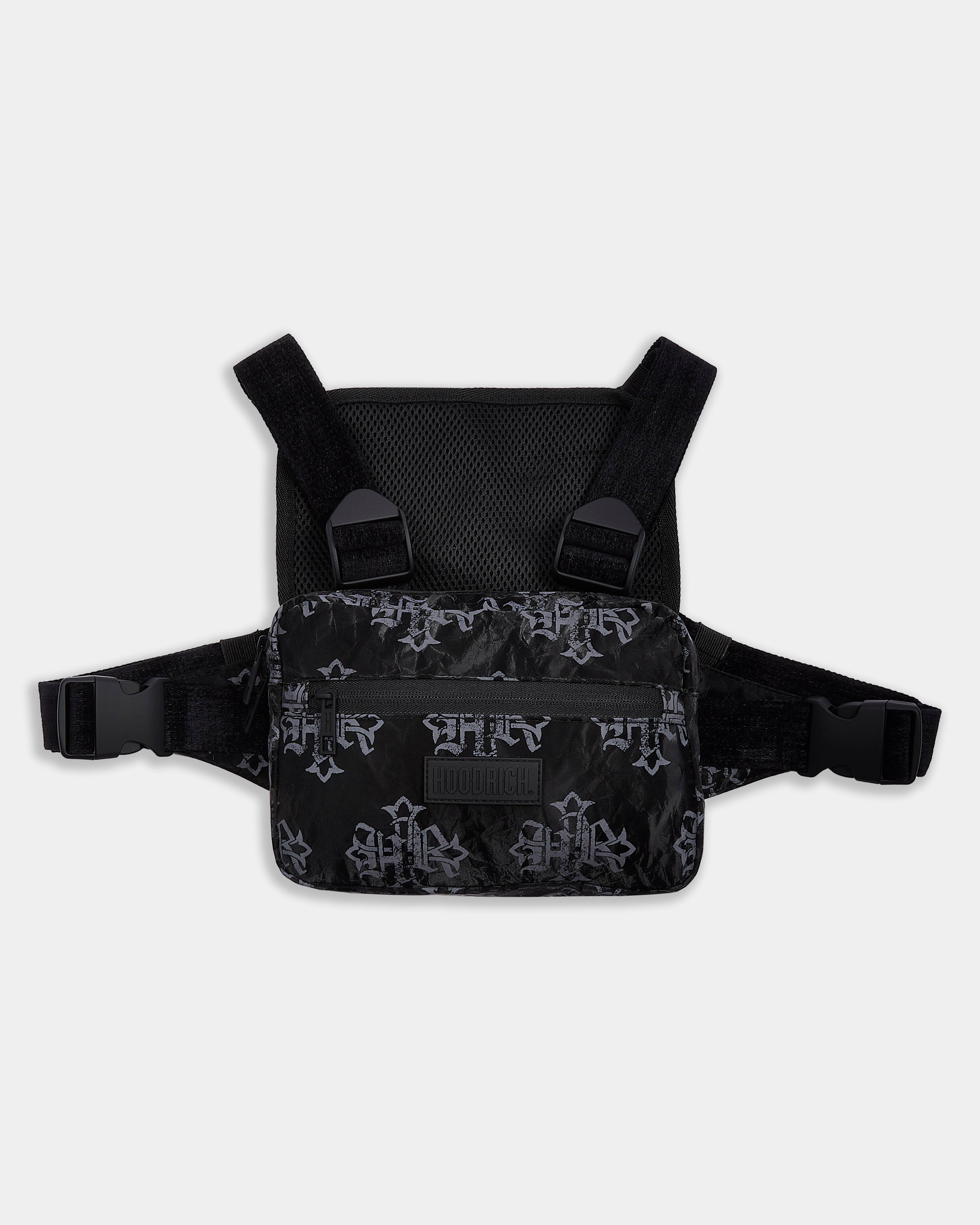 Black chest harness with cross patterns on a light gray background