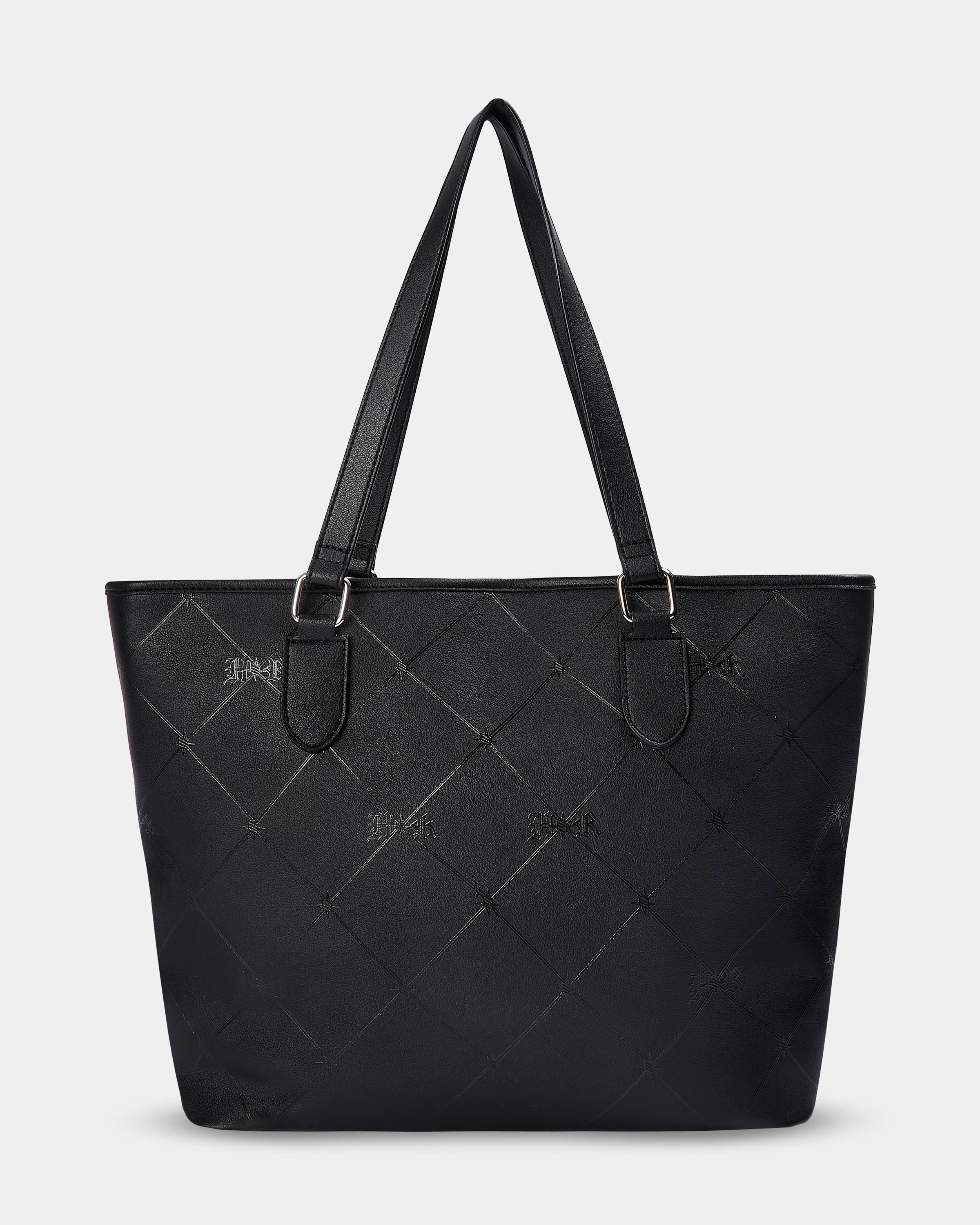 Black quilted handbag on a light gray background
