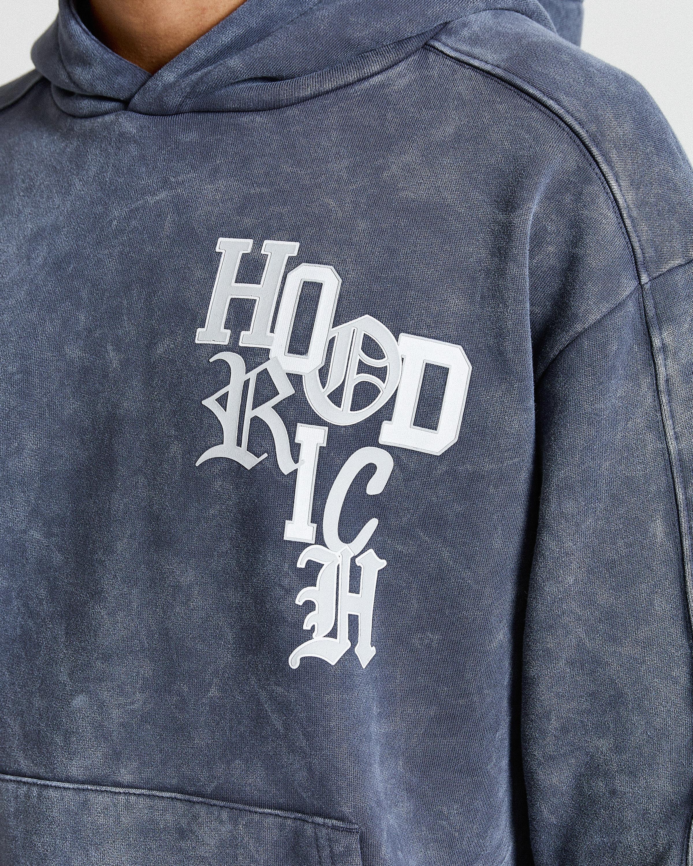 Blue hoodie with white text on a plain background