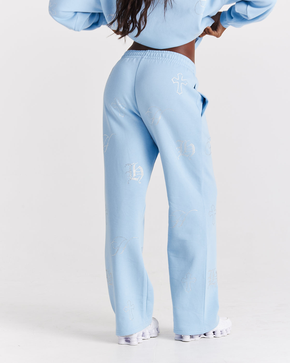 Displays a model wearing the blue 'Hoodrich' branded women's Crystal Full Tracksuit
