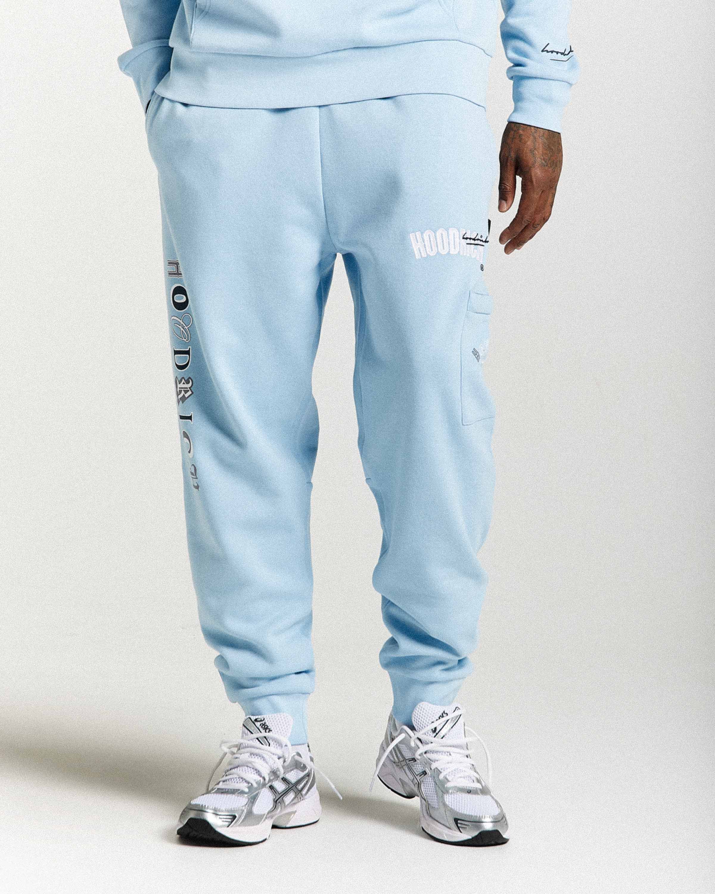 Light blue tracksuit with branding on a white background