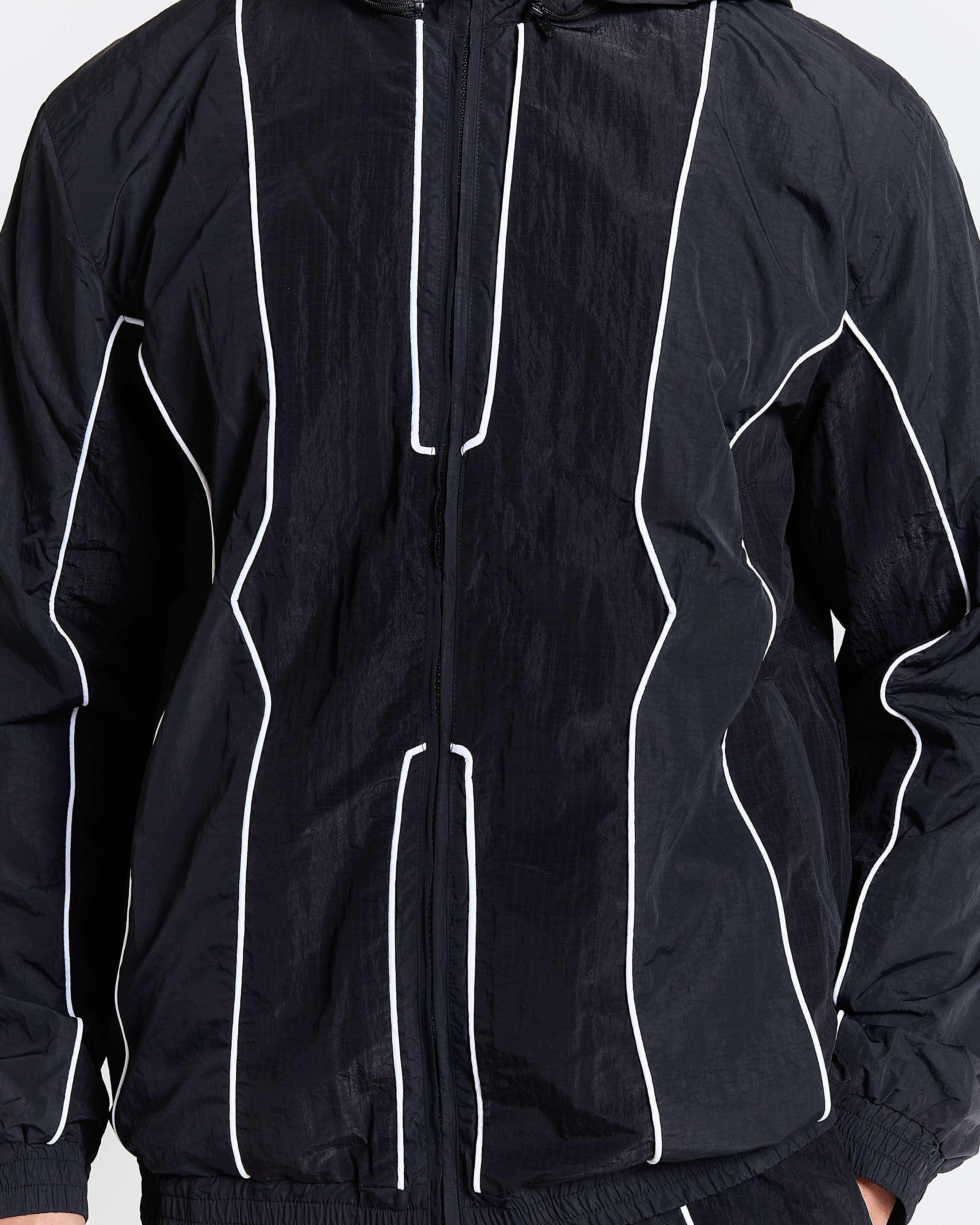 Black jacket with white piping on a white background