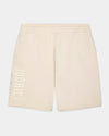 Cream-colored athletic shorts with a vertical 'HOODRICH' logo printed in tonal cream on the left leg, shown against a light gray background.
