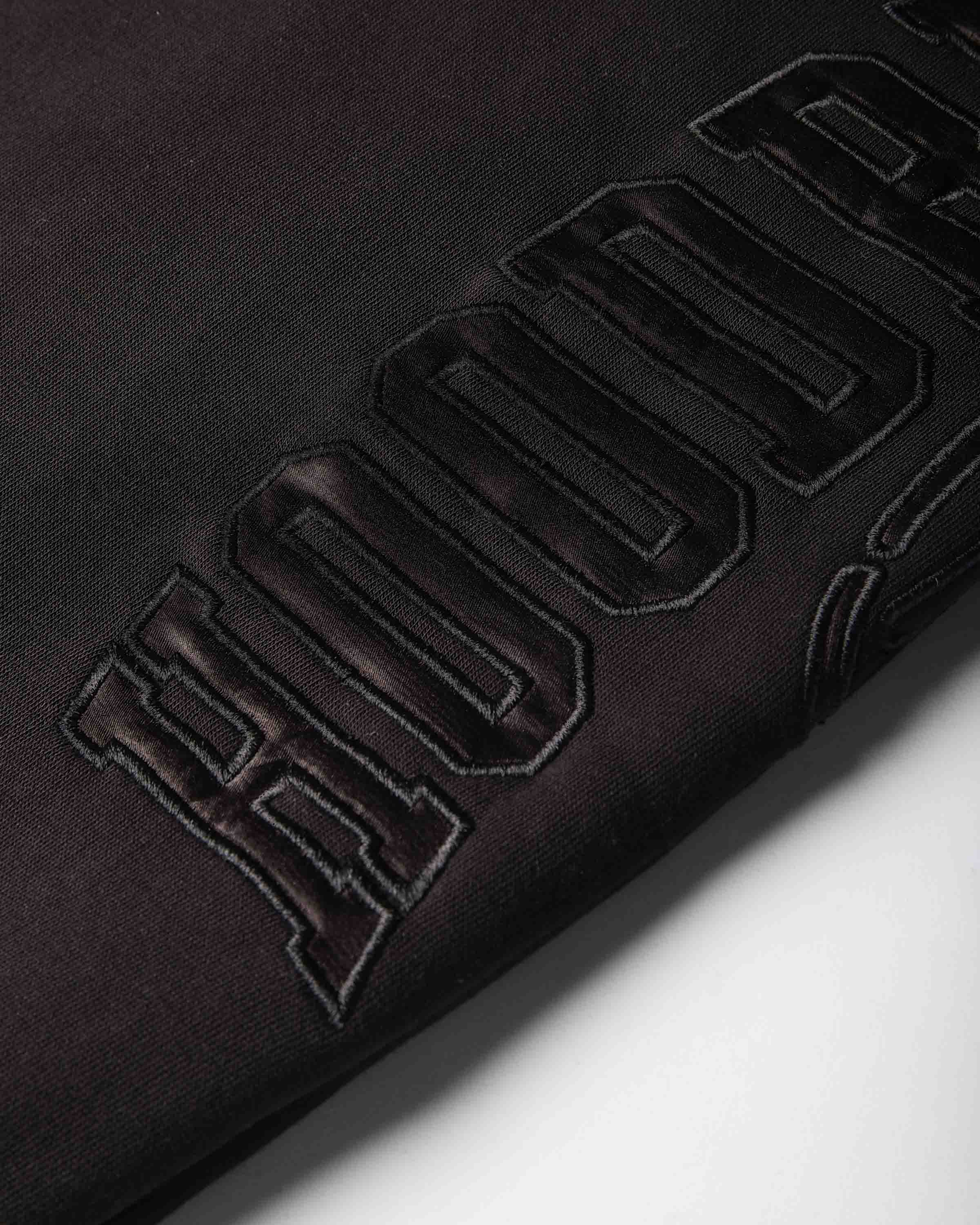 Displays a women wearing the Black 'Hoodrich' branded women's Aegis Full Tracksuit