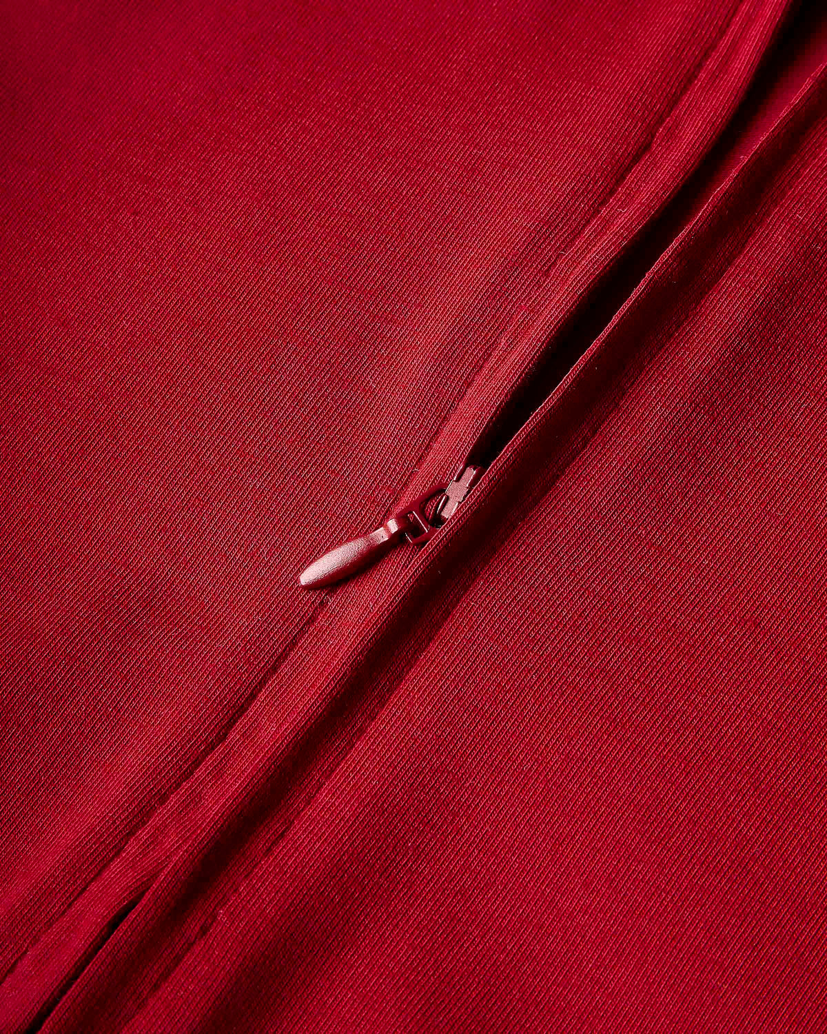 Displays the Red 'Hoodrich' branded women's Gleam Full Tracksuit featuring the details on the zip 