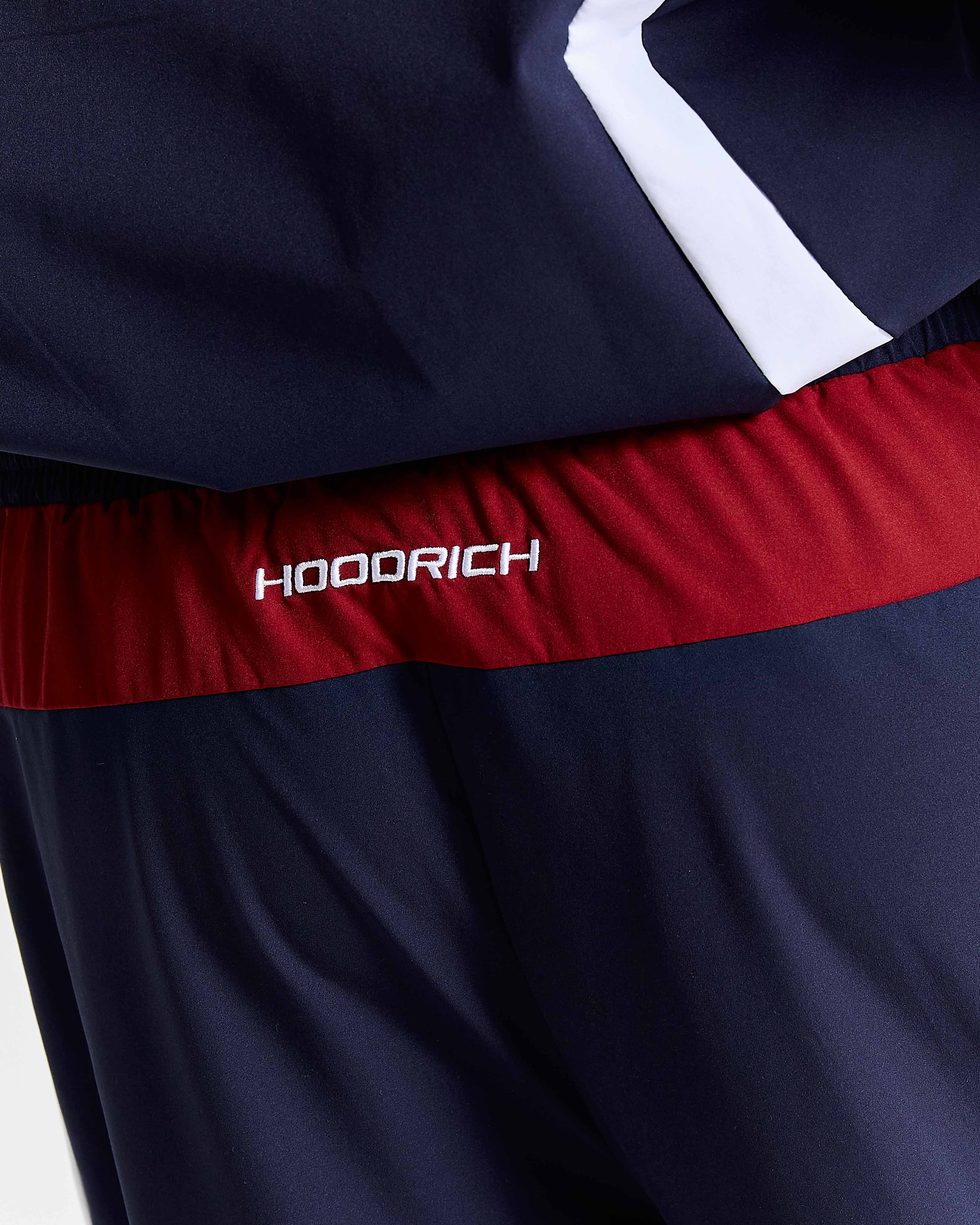 Navy shorts with a red waistband and white logo on a white background