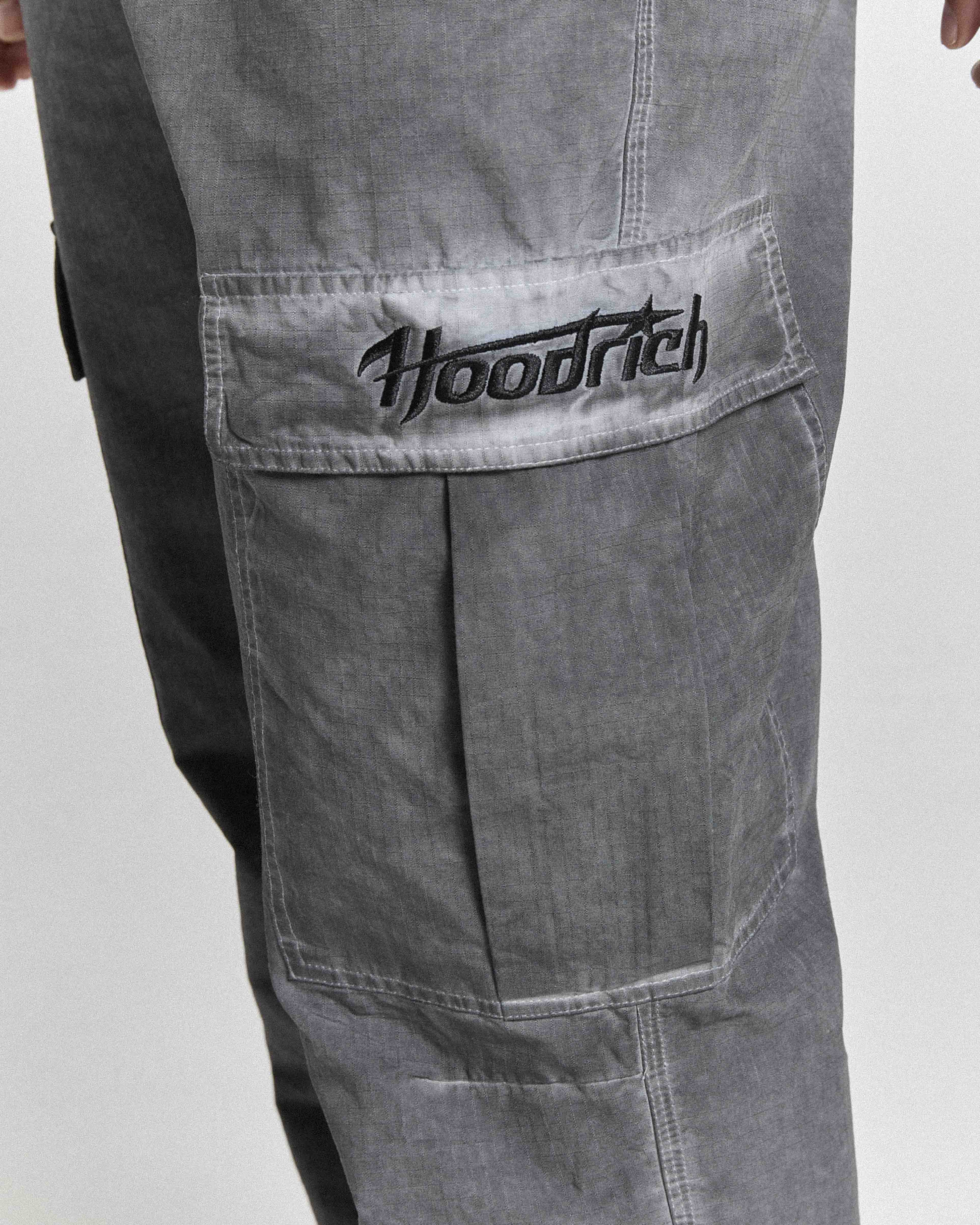 Gray pants with 'Hoodrich' logo on a white background