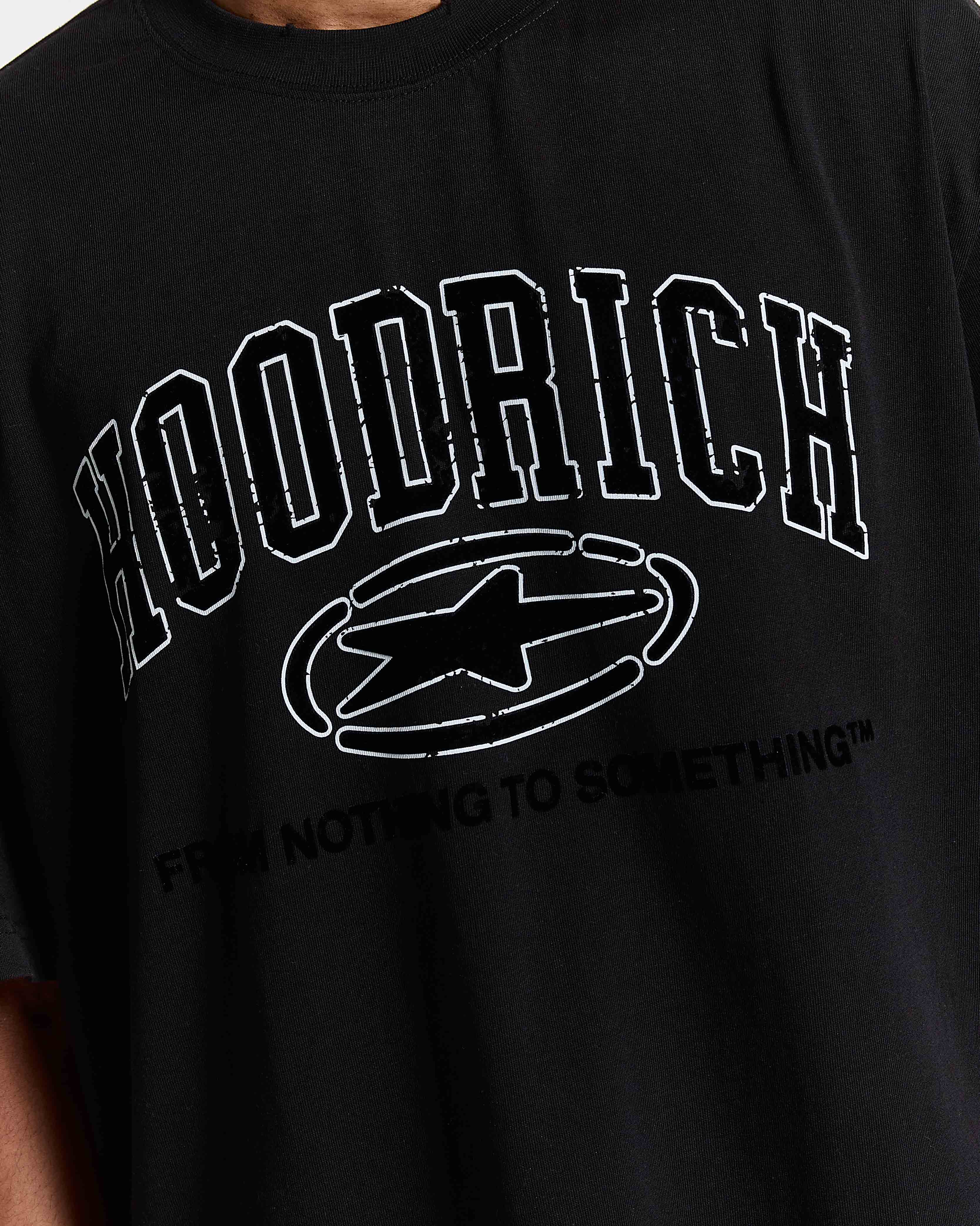 Black t-shirt with 'Hoodrich' logo and text on a person wearing it.