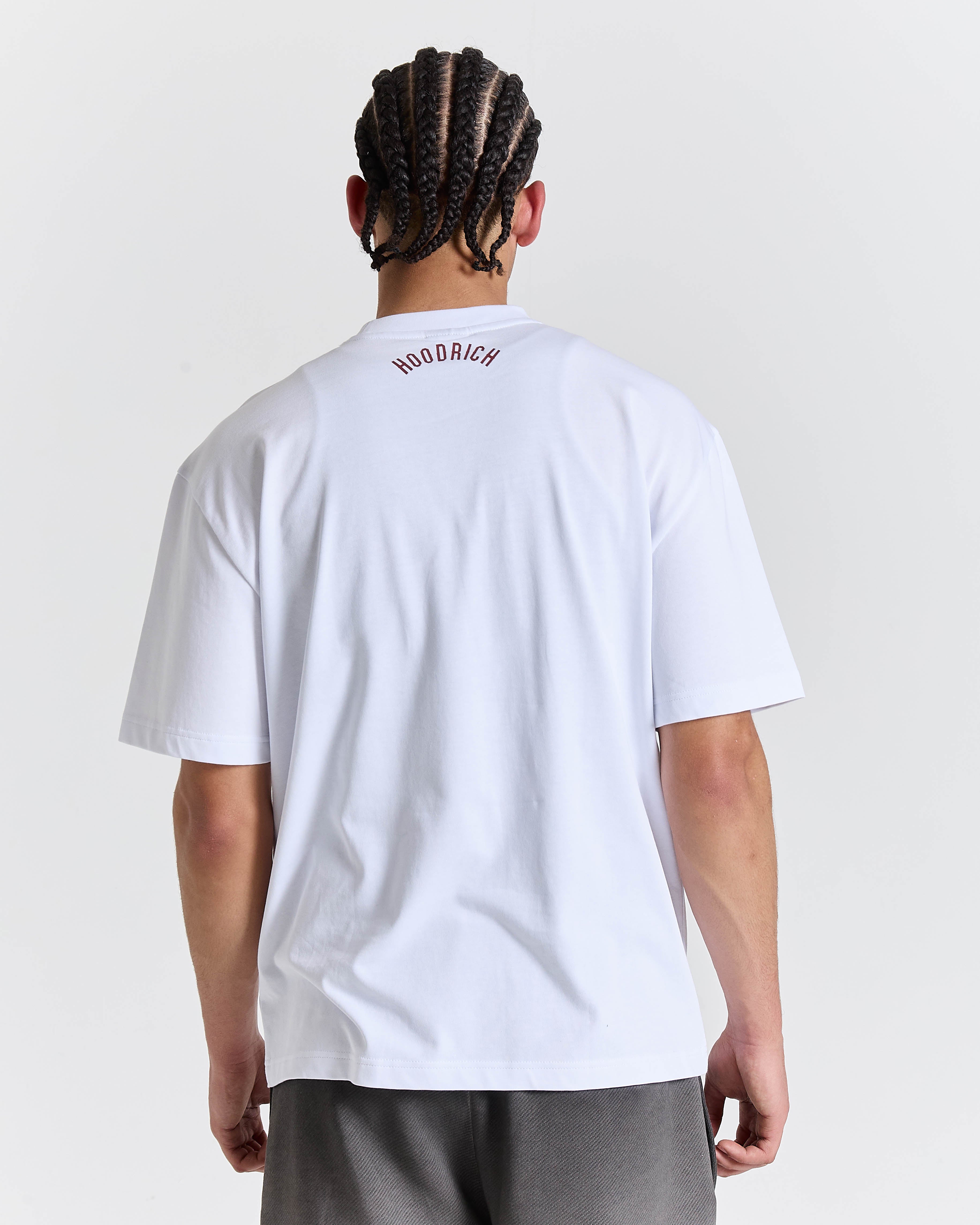 Person wearing a white t-shirt with 'Woodrich' branding on the back, standing against a plain background.