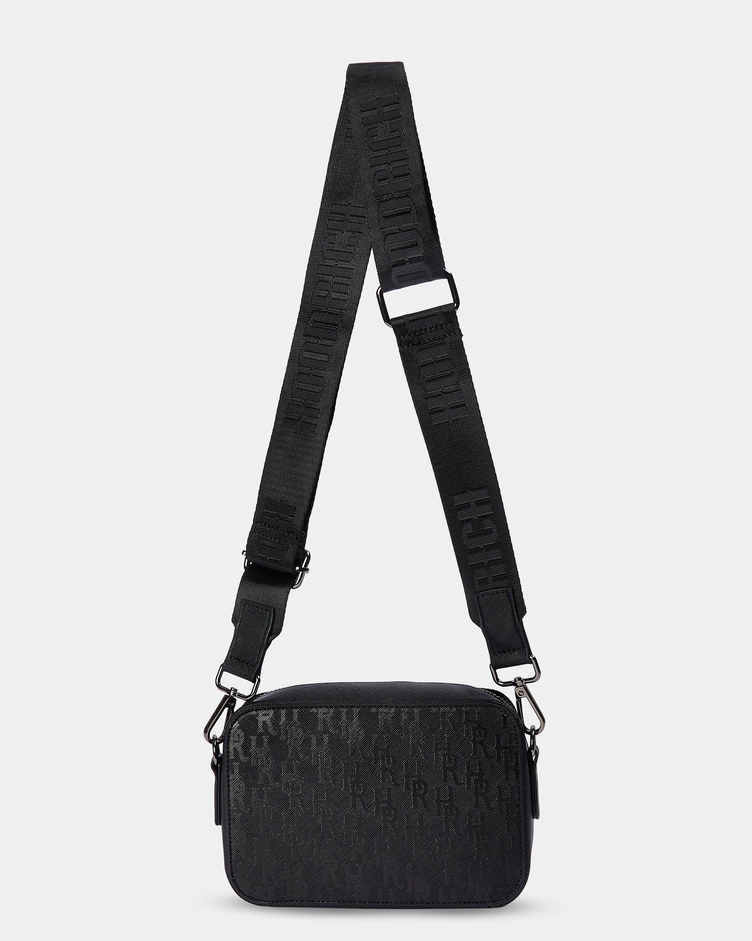 Black textured bag with a strap on a light gray background