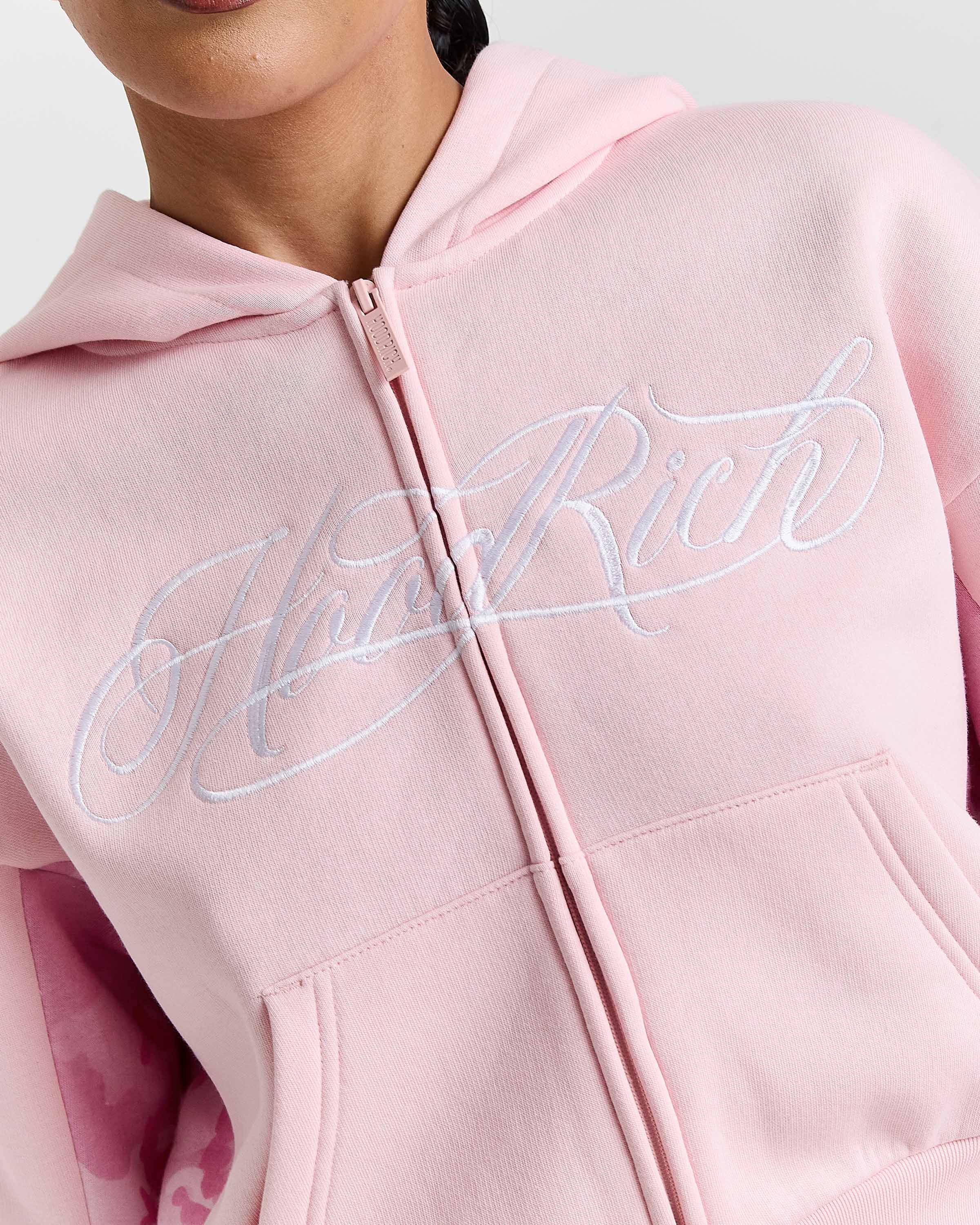 Displays a model wearing the Pink "Hoodrich' branded women's Field Full Tracksuit