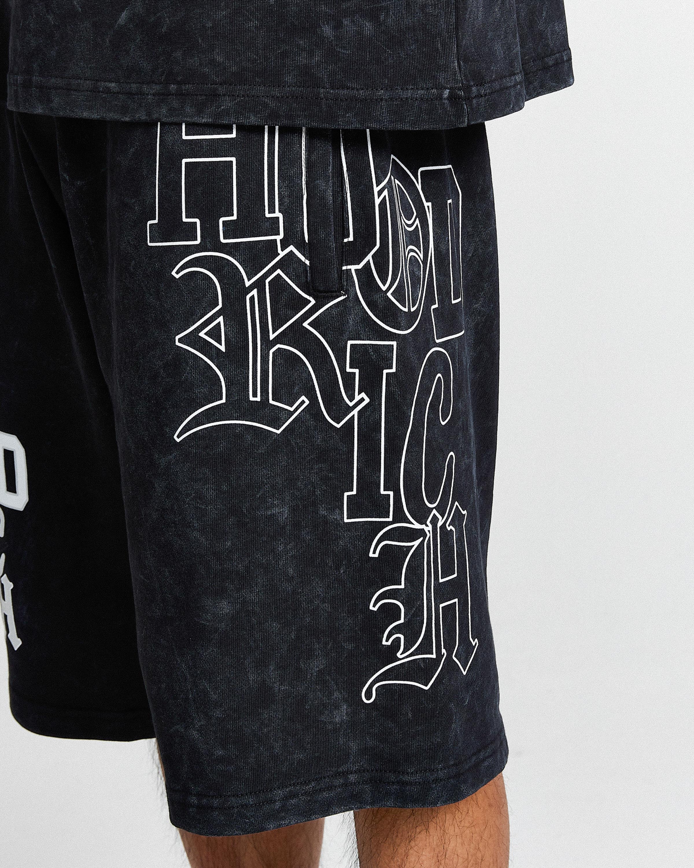 Black shorts with white text on a white background