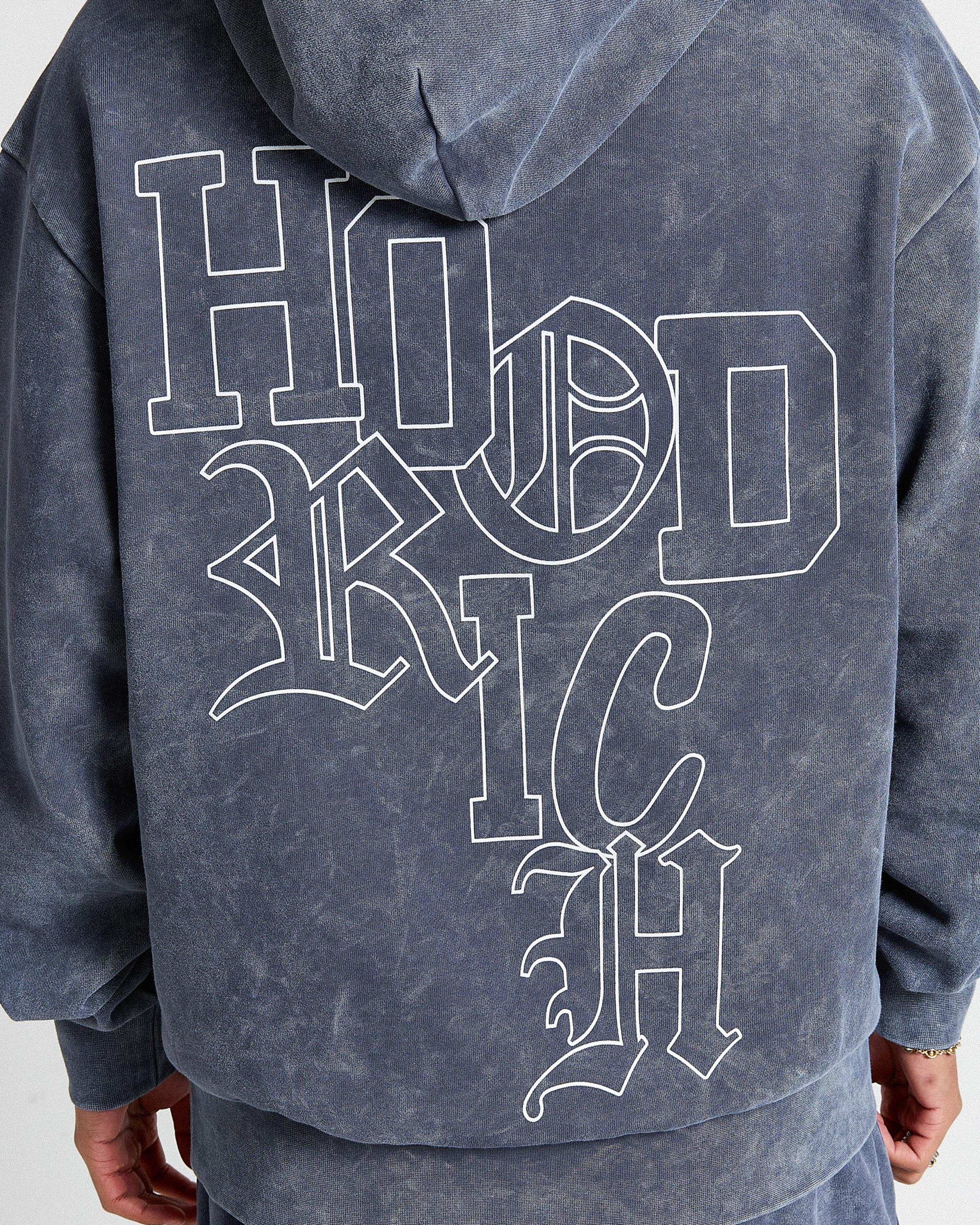 Blue hoodie with white text on the back.
