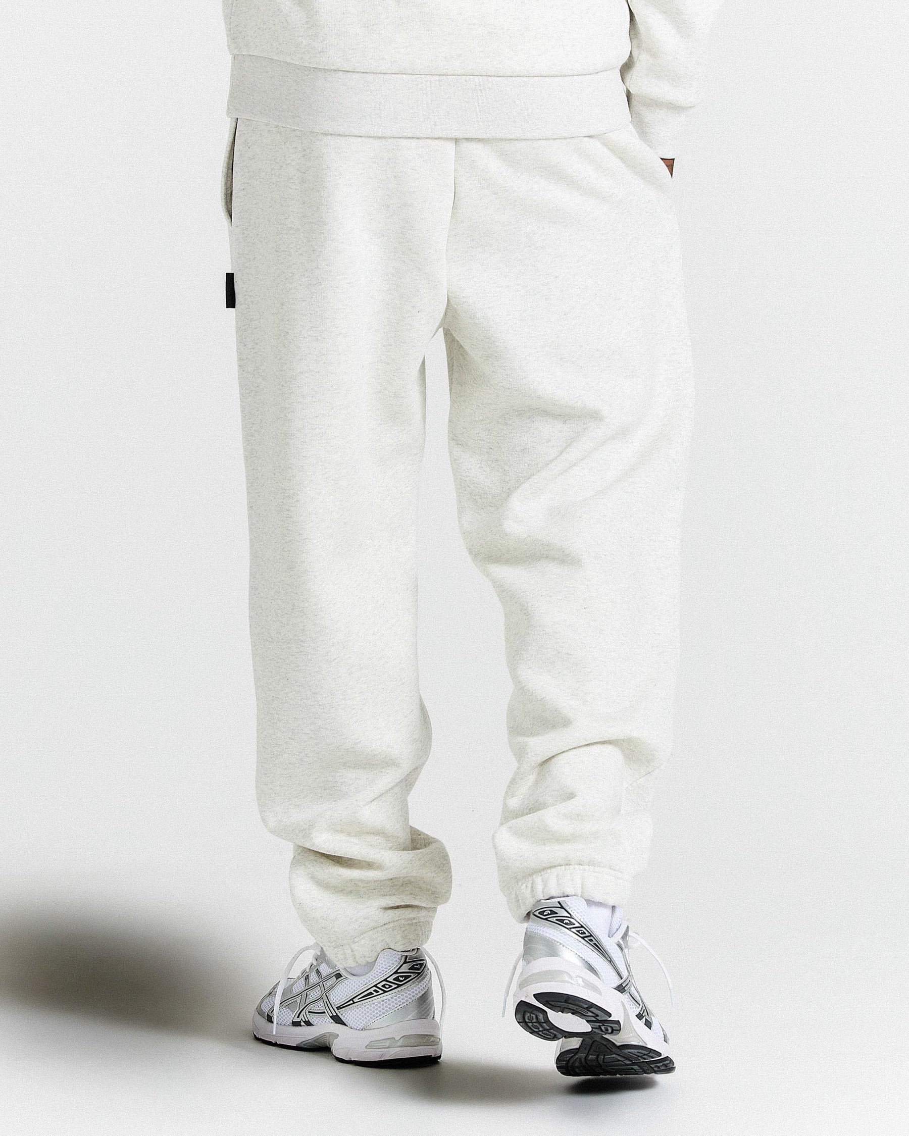 Light Grey pants and sneakers on a white background