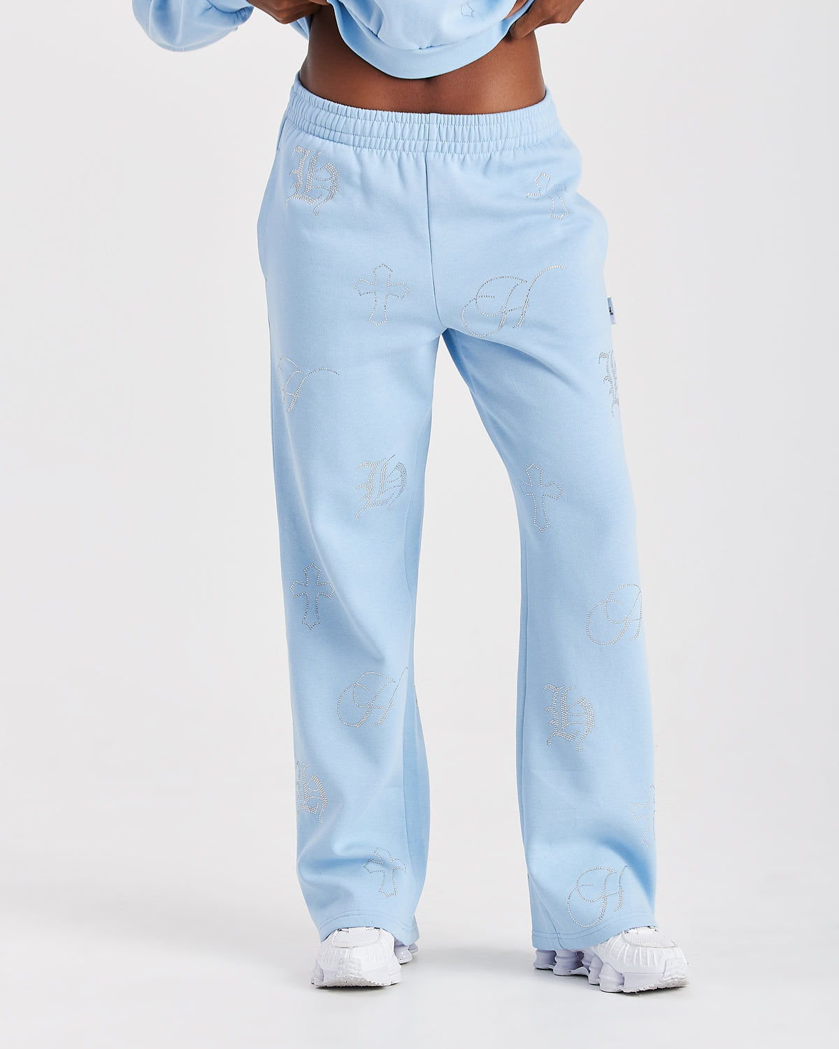 Displays a model wearing the blue 'Hoodrich' branded women's Crystal Full Tracksuit