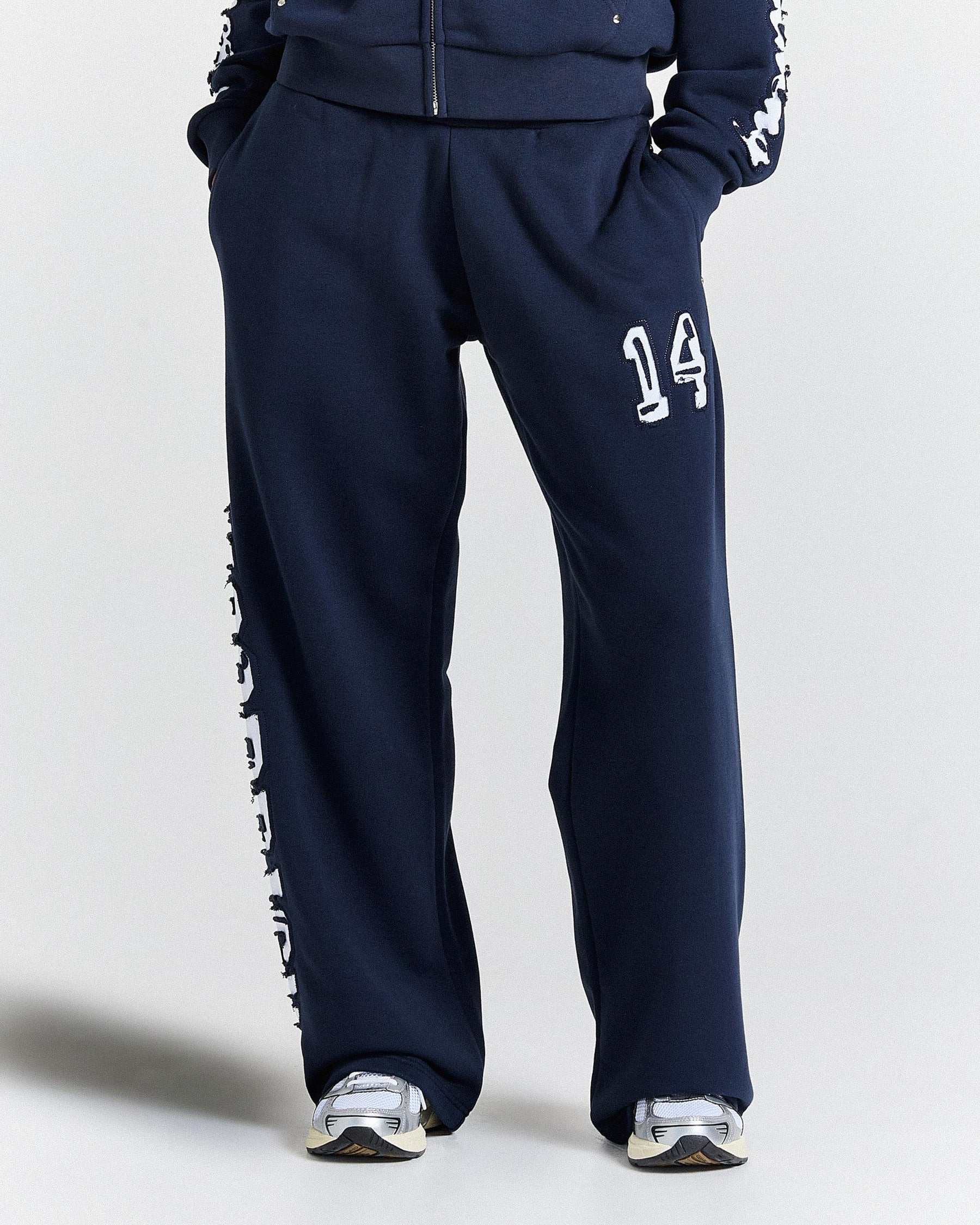 Navy tracksuit with number 14 on a light gray background