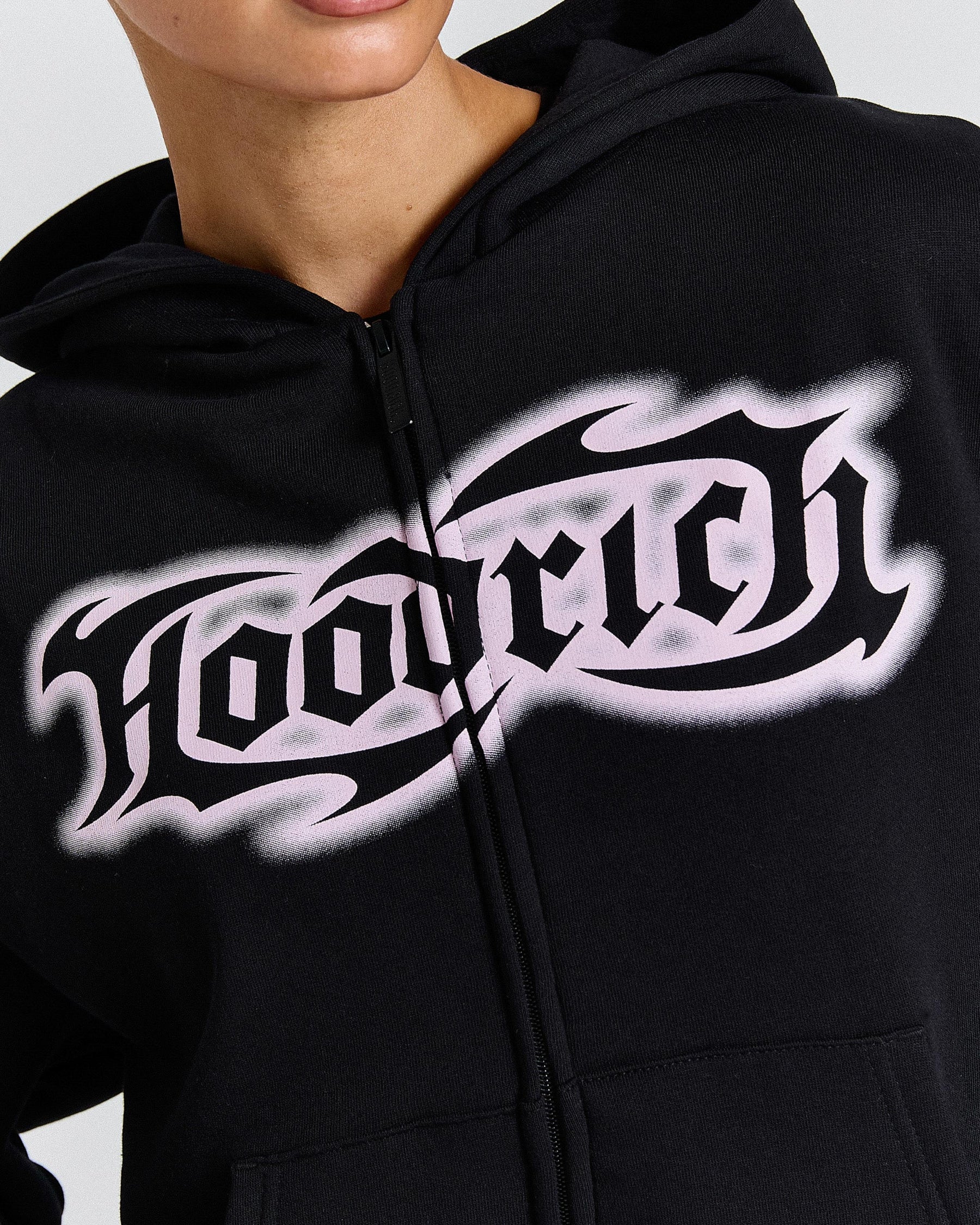 Black hoodie with white 'HOODRICH' text design on a plain background