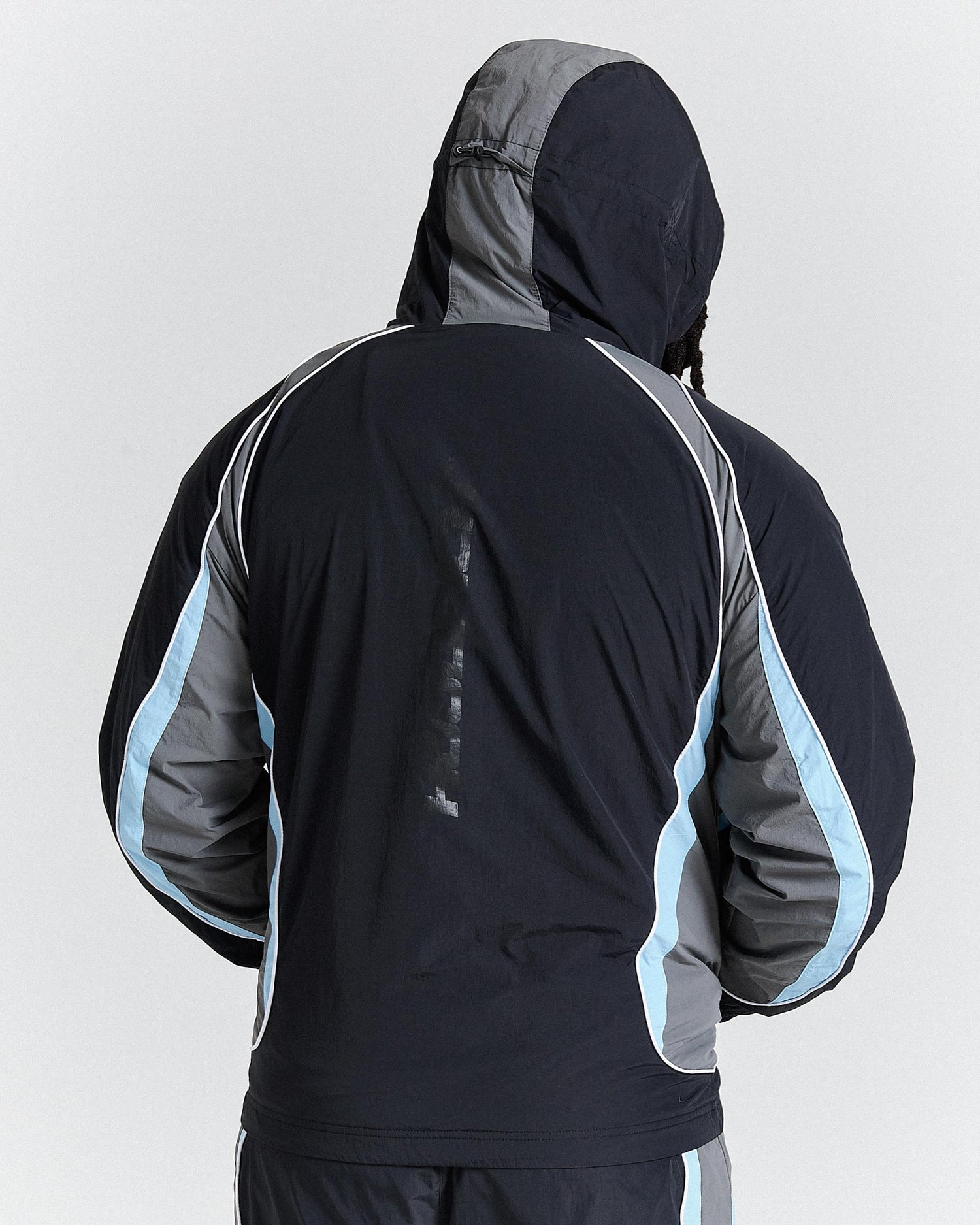 Black and gray jacket with blue accents on a white background