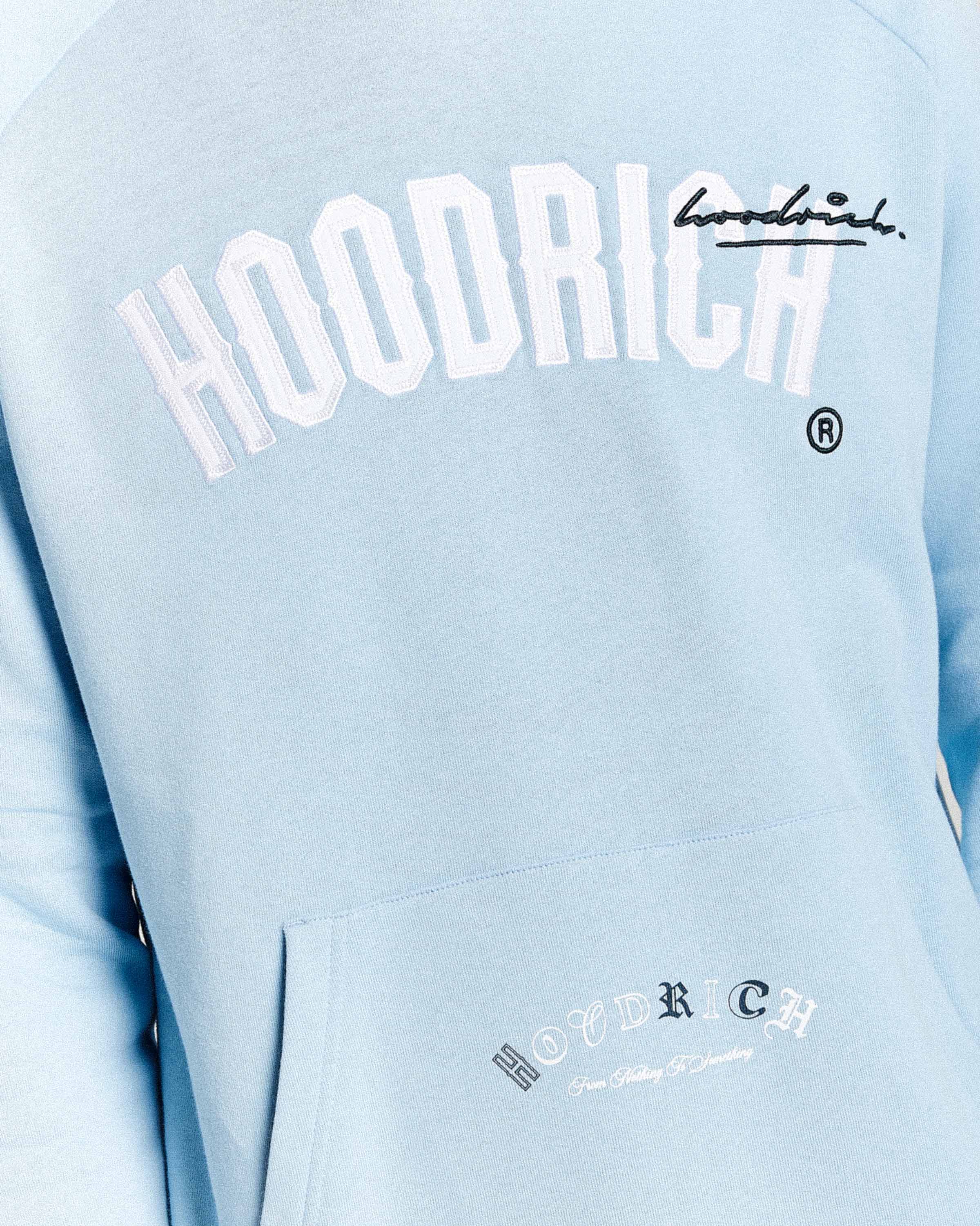 Light blue hoodie with 'Hoodrich' branding on a light gray background